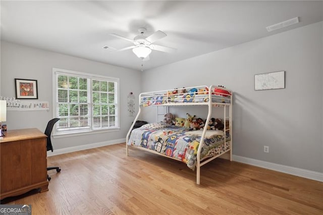 bedroom featuring ceiling fan and light hardwood / wood-style flooring