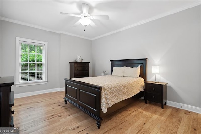 bedroom with light hardwood / wood-style flooring, ceiling fan, and ornamental molding