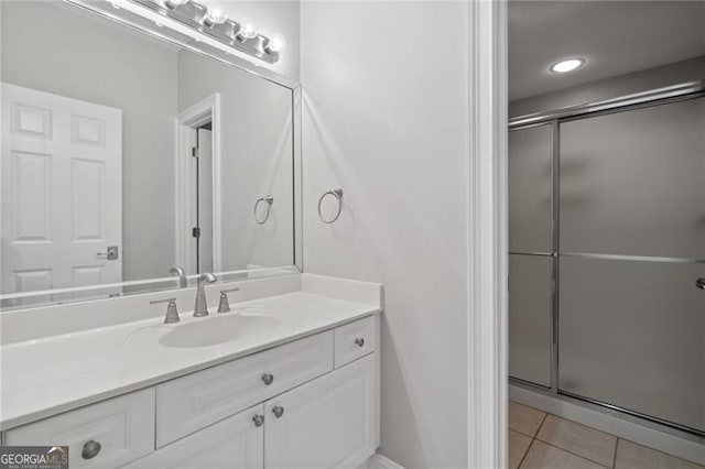 bathroom with vanity, tile patterned floors, and an enclosed shower