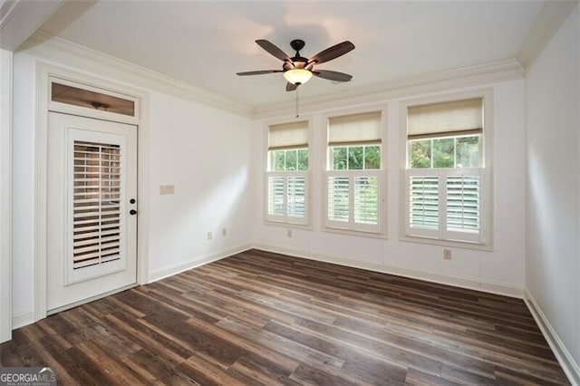 unfurnished room featuring crown molding, ceiling fan, and dark wood-type flooring