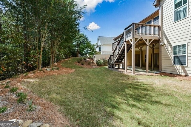 view of yard featuring a wooden deck