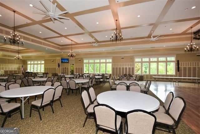 dining area featuring ceiling fan, beam ceiling, and coffered ceiling