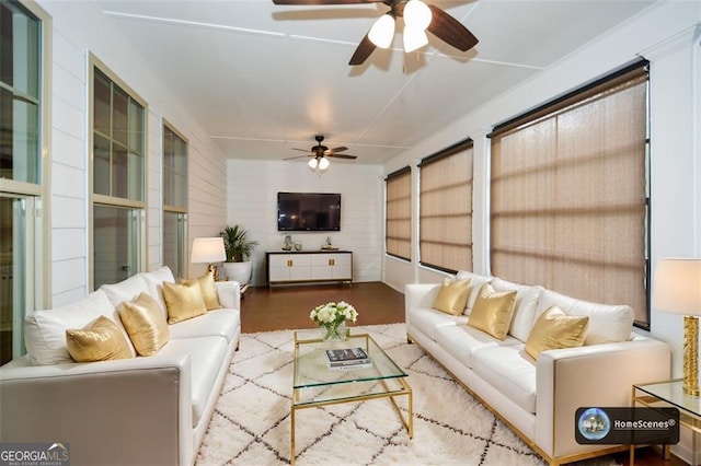 living room with wood-type flooring and ceiling fan