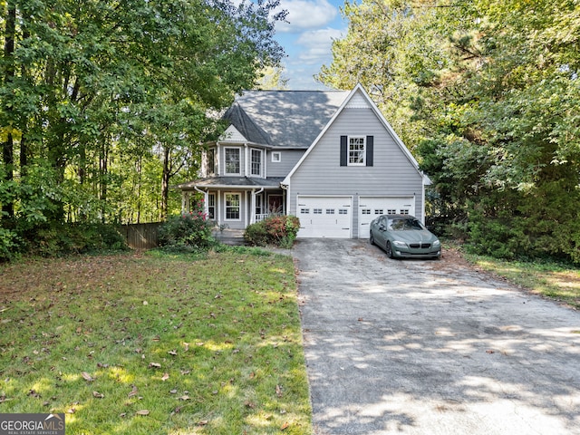 view of front facade with a front lawn and a garage