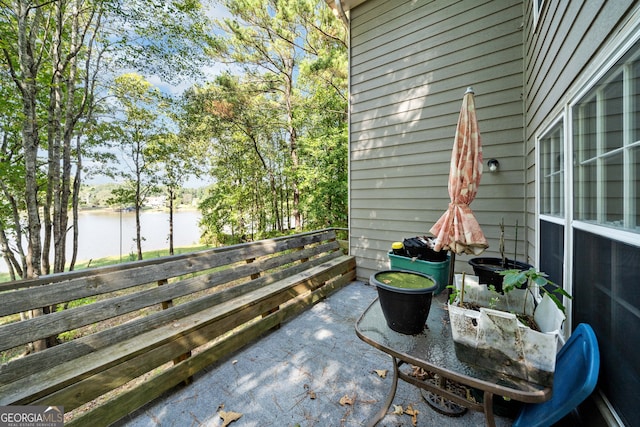 view of patio with a water view