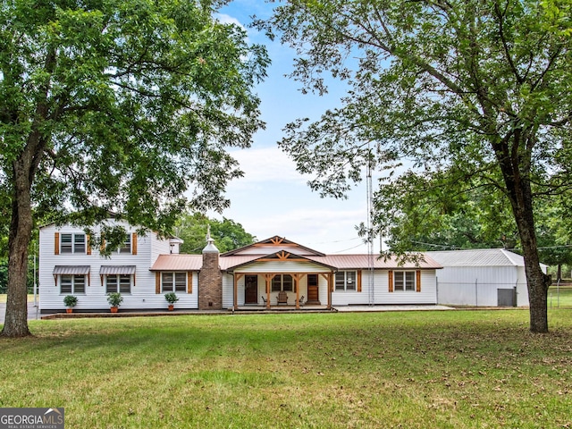 view of front of house with a porch and a front yard