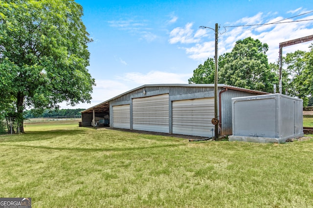 garage with a yard