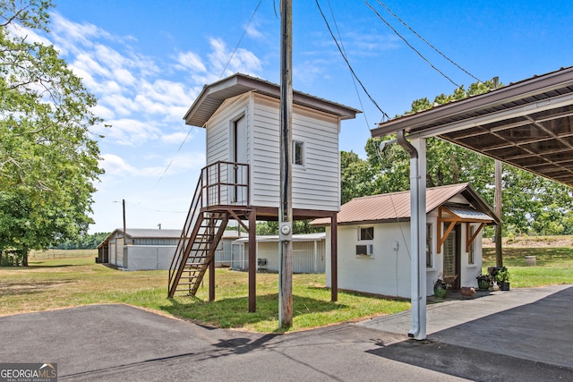 view of property exterior with a yard