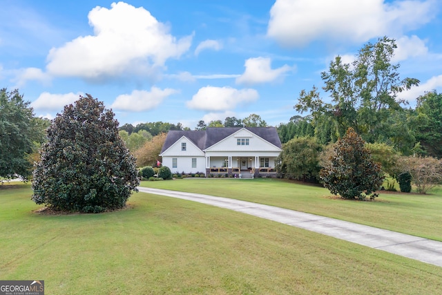 view of front facade with a front yard and a porch