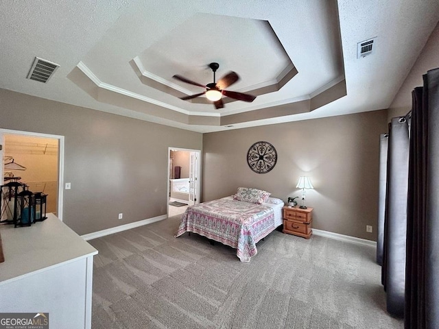 carpeted bedroom with crown molding, a raised ceiling, and ceiling fan