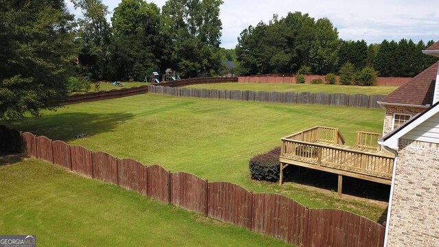 view of yard featuring a wooden deck