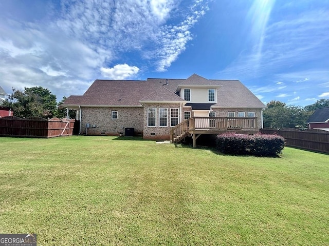 back of house with a yard, a deck, and central air condition unit