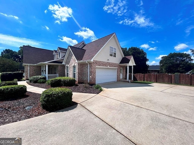 view of front of home featuring a garage and covered porch