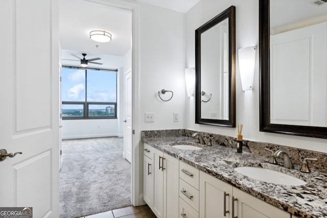 bathroom featuring ceiling fan, vanity, and tile patterned floors