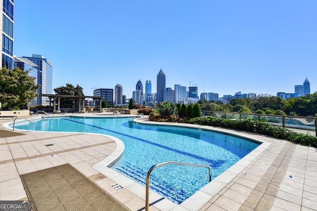 view of swimming pool with a patio