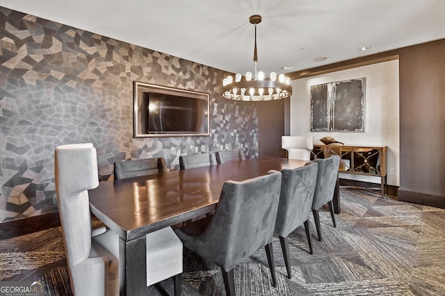 dining area featuring an inviting chandelier