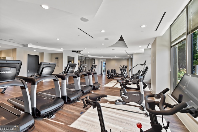 gym with hardwood / wood-style floors