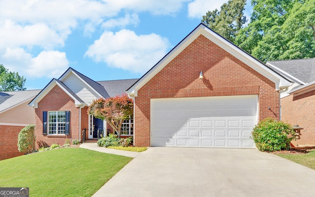 view of front property featuring a front yard and a garage