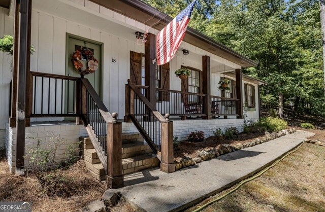 view of property exterior with a porch