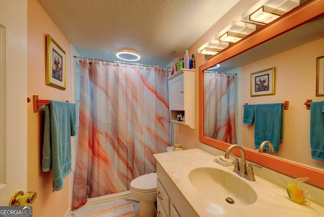 bathroom featuring vanity, toilet, a textured ceiling, and curtained shower