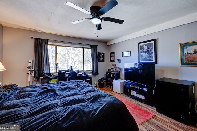 bedroom featuring wood-type flooring and ceiling fan