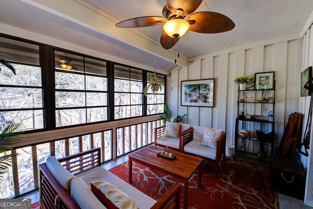 interior space with ceiling fan