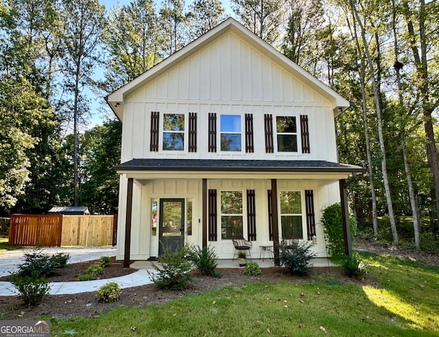 view of front of property with a front yard and covered porch