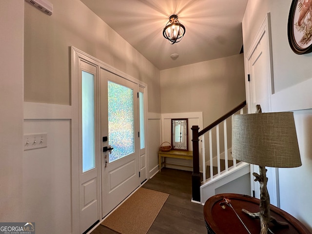 entrance foyer with dark hardwood / wood-style floors