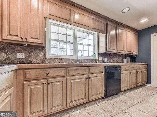 kitchen featuring black dishwasher, sink, decorative backsplash, and light tile patterned flooring