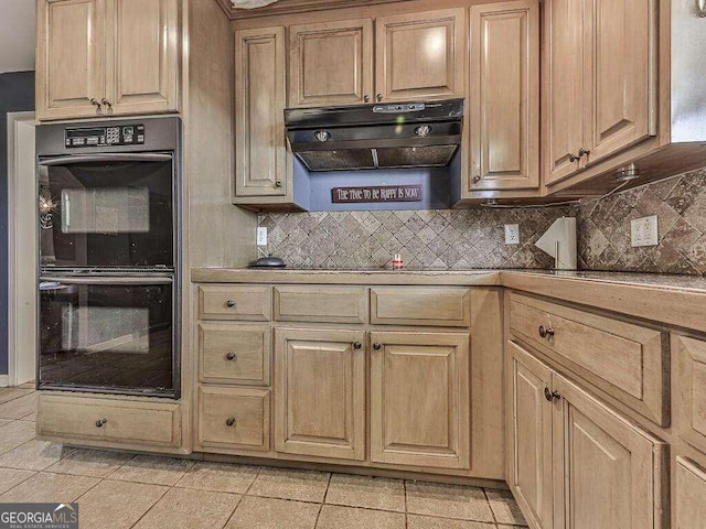 kitchen featuring decorative backsplash, double oven, and light tile patterned floors