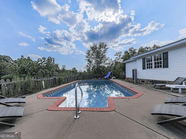 view of pool featuring a patio and a water slide