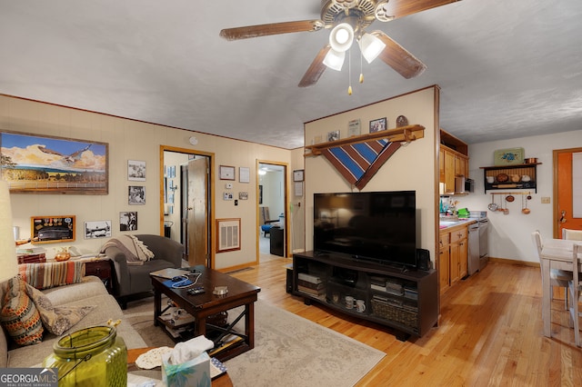 living room with ceiling fan and light wood-type flooring