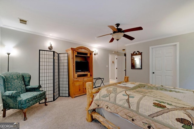 bedroom featuring ornamental molding, ceiling fan, and light colored carpet