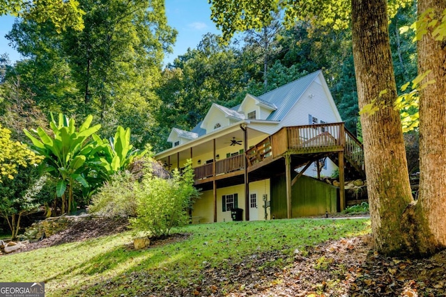 rear view of house with a wooden deck