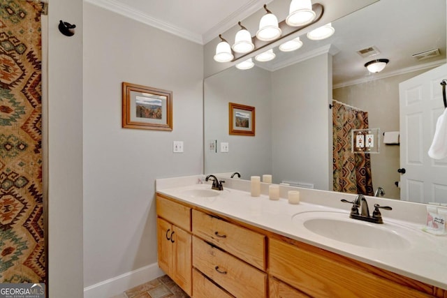 bathroom with crown molding and vanity