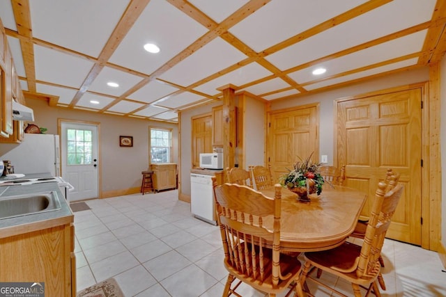 tiled dining area with coffered ceiling and sink