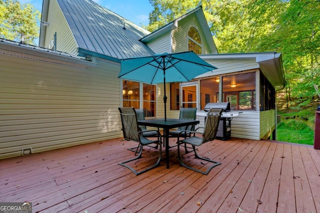 wooden deck with a grill