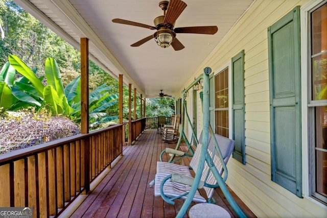 wooden deck featuring ceiling fan and a porch