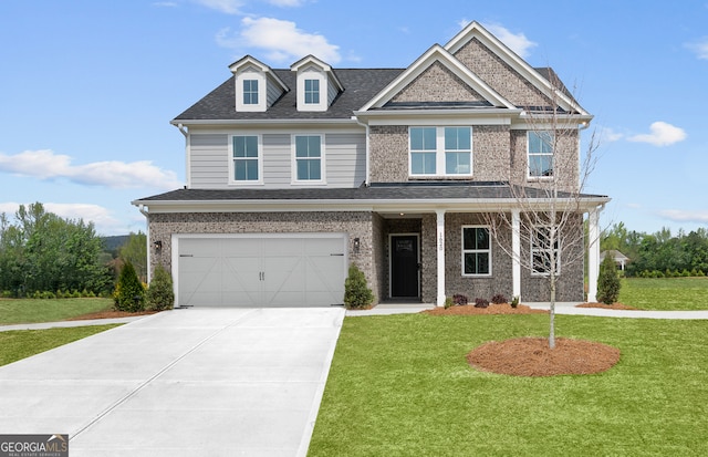 view of front of house featuring a garage and a front lawn