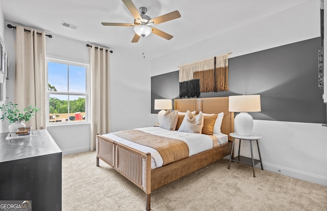 carpeted bedroom featuring ceiling fan