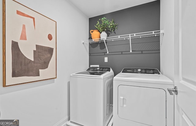 clothes washing area featuring washing machine and clothes dryer