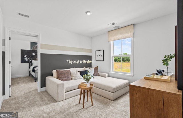 living room with light colored carpet