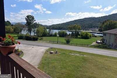 view of yard featuring a water and mountain view