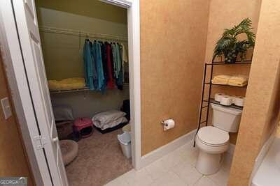 bathroom with tile patterned flooring and toilet