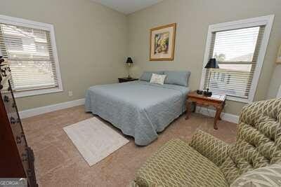 bedroom with light carpet