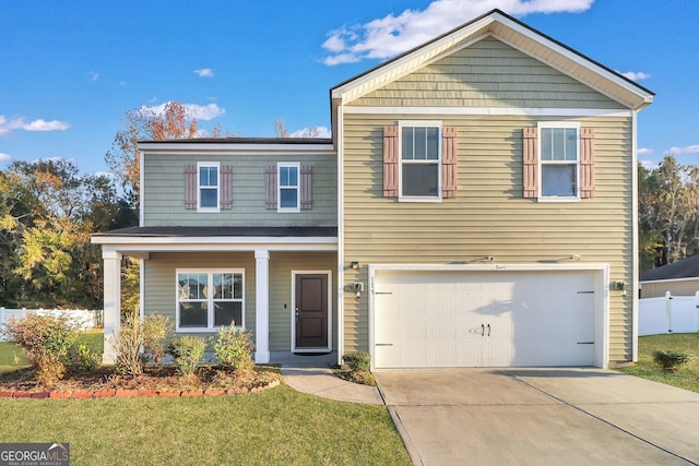 view of front of house featuring a garage and a front lawn