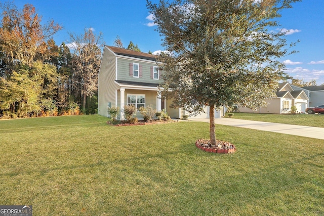 view of front of house featuring a front lawn and a garage