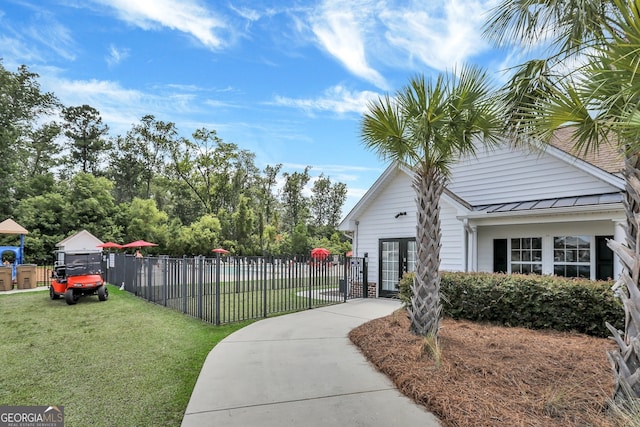 surrounding community featuring a yard