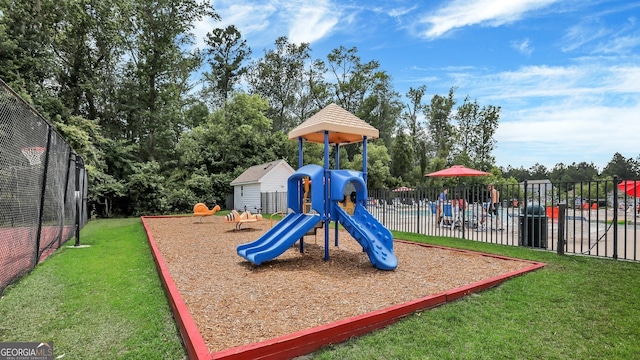 view of play area featuring a lawn