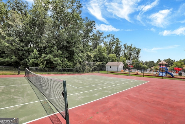 view of sport court featuring a playground